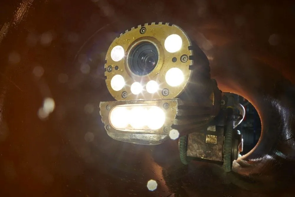CCTV sewer inspection camera with its lights on