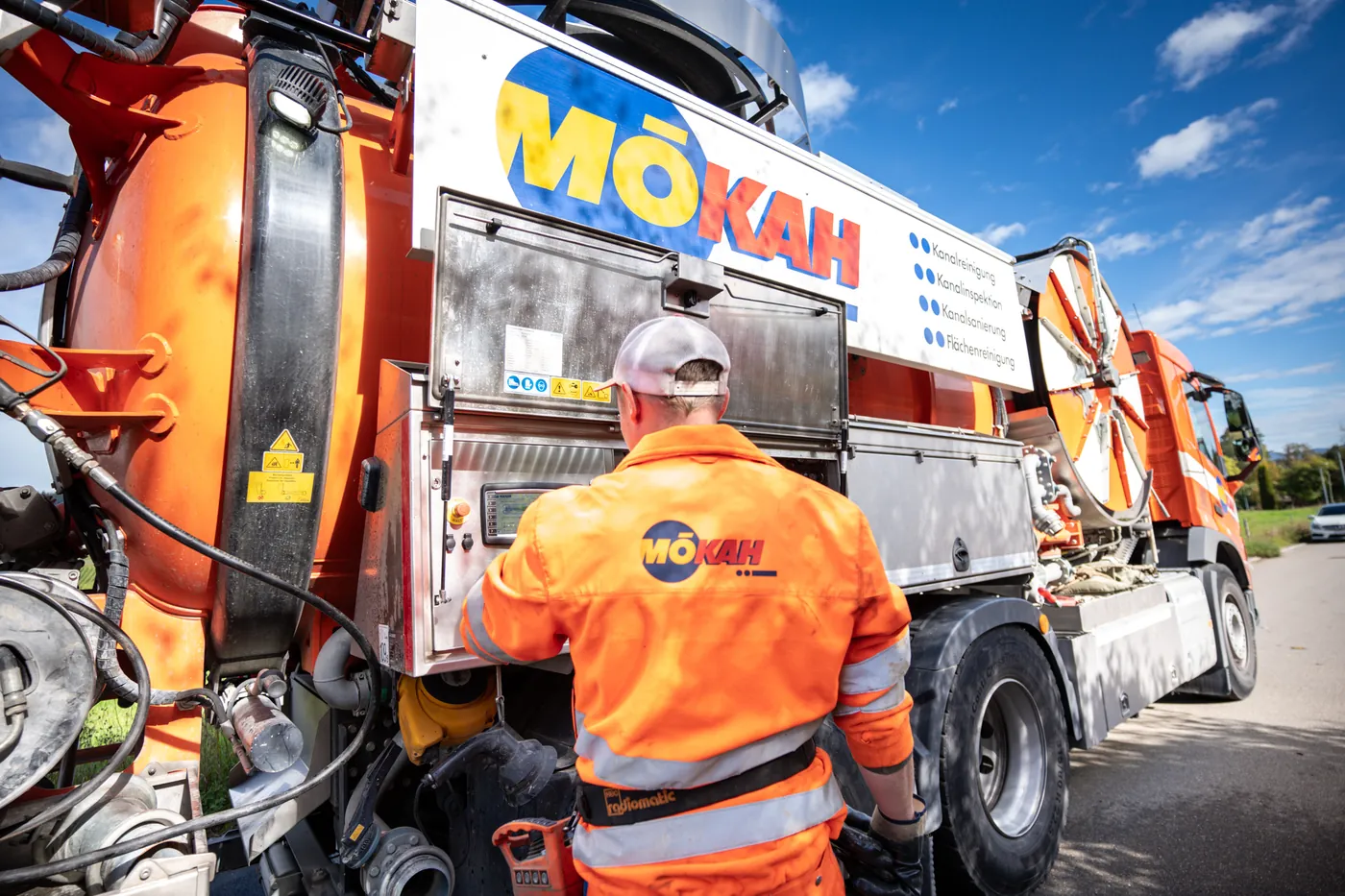 Operator at the controls of a combination sewer-cleaning truck