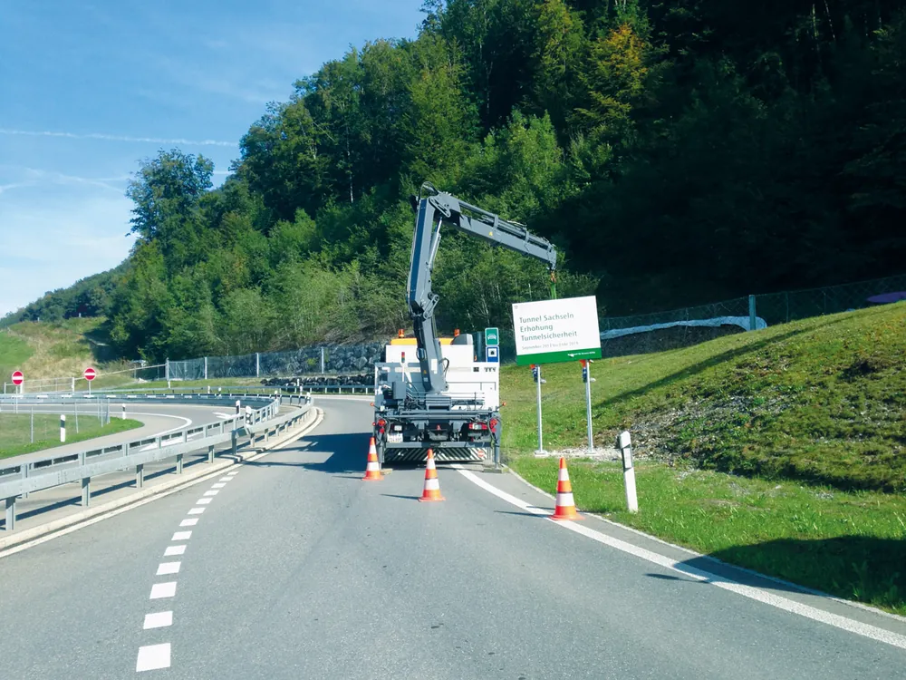 Road safety crew working on a motorway slip road in Switzerland