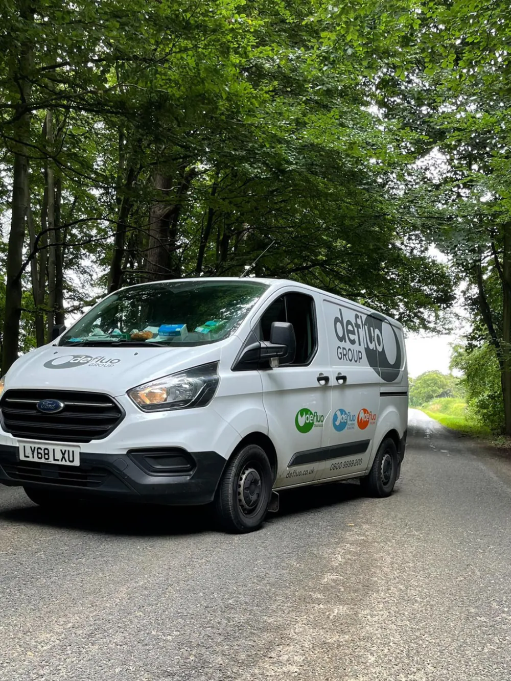 Defluo service van on a country lane in England
