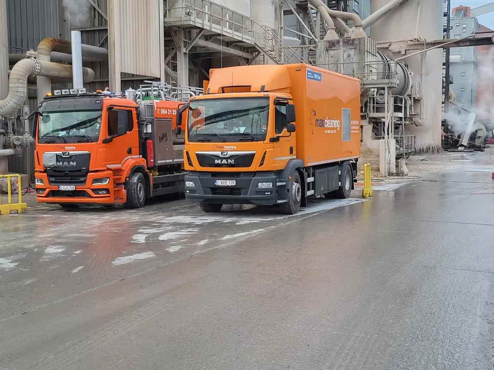 Two vacuum tankers at an industrial plant