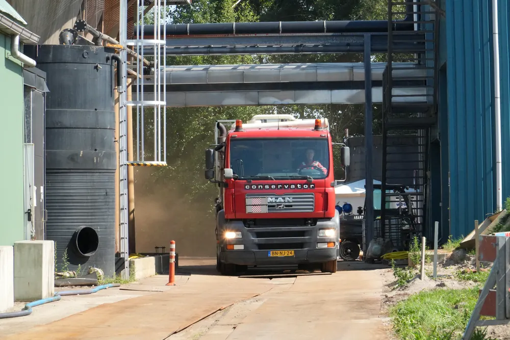 Vacuum truck leaving an industrial site