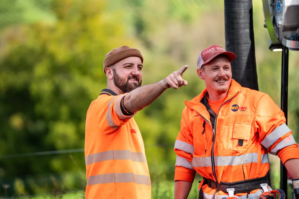 Two KSG sewer specialists sharing a laugh on site